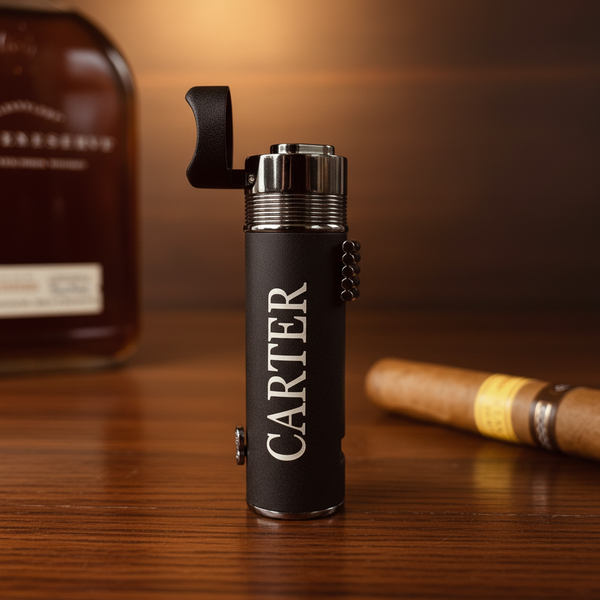 Personalized triple torch cigar lighter with engraved initials, displayed with cigar and whiskey bottle — ideal beginner gear for learning how to smoke a cigar
